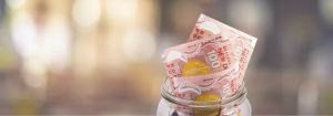 money and savings in a jar: KiwiSaver 