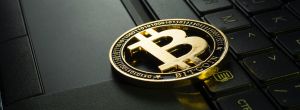 cryptocurrency trader: Bitcoin on a laptop